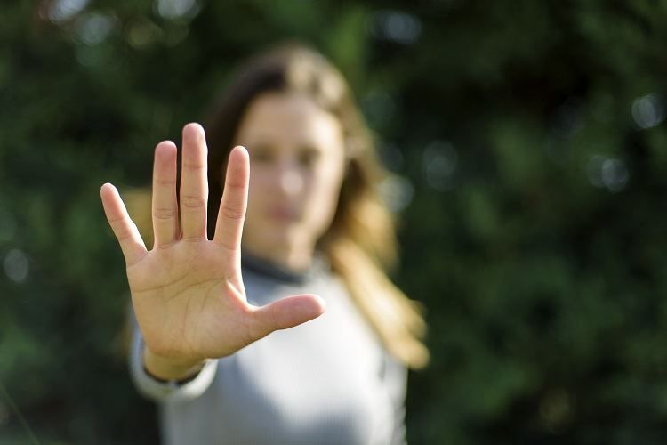 Woman with her hand raised - Maryland restraining order